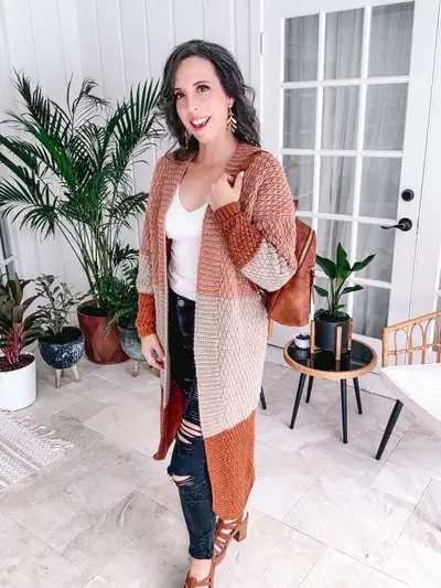 Rust and cream Robin Duster worn with ripped jeans