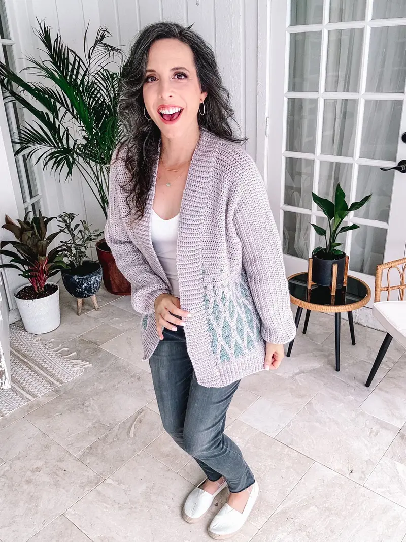 Woman wearing the lavender Seabird Mosaic Cardi with a teal mosaic band