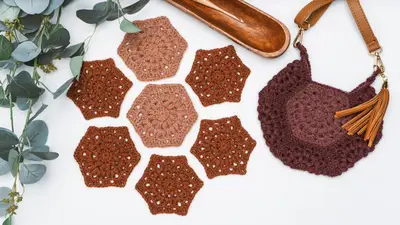 Seven Hexi Granny Bag hexagons in brown with a finished bag and leather strap
