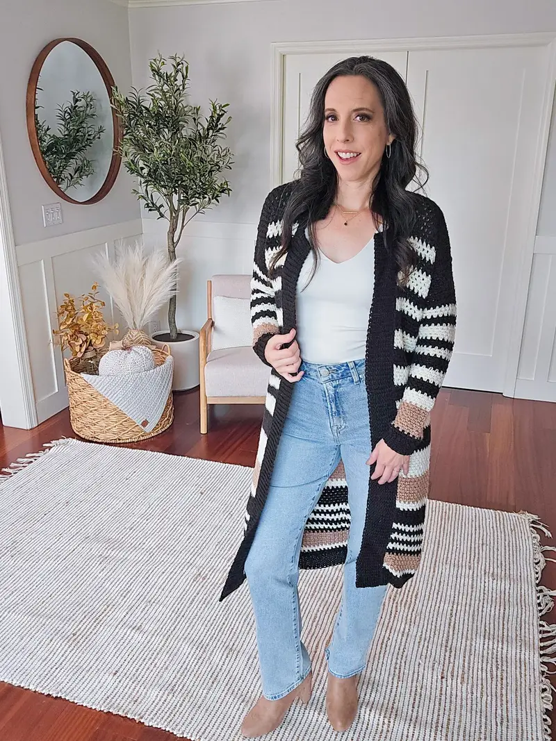 Woman wearing the Shortbread Crochet Duster in black, white and tan stripes