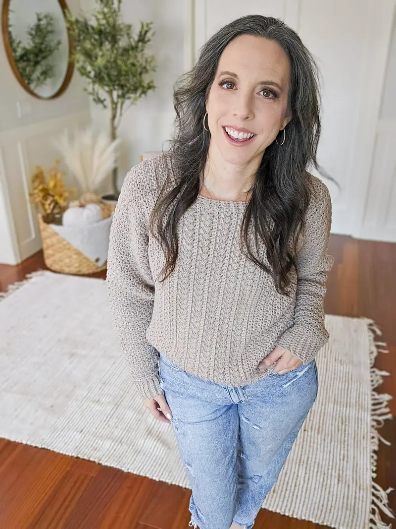 Woman wearing the oatmeal Toasty Wheat Crochet Pullover with jeans