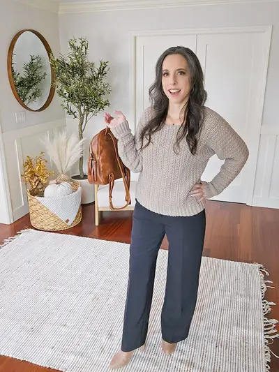Full length view of the oatmeal Toasty Wheat Crochet Pullover with gray pants