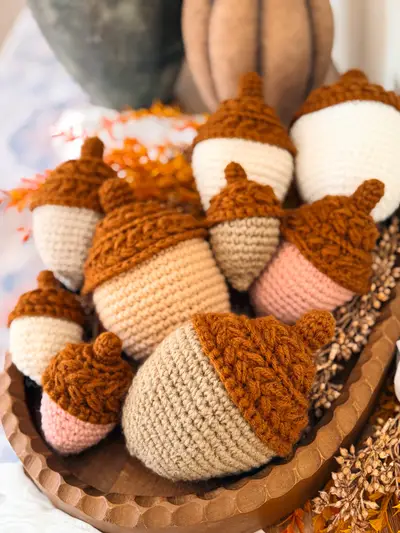Bowl of Wheat Stitch Acorns in cream, tan and pink with rust caps