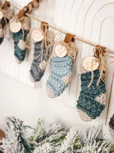 Wheat Stitch Advent Crochet Stockings in blue and gray hanging with numbered tags