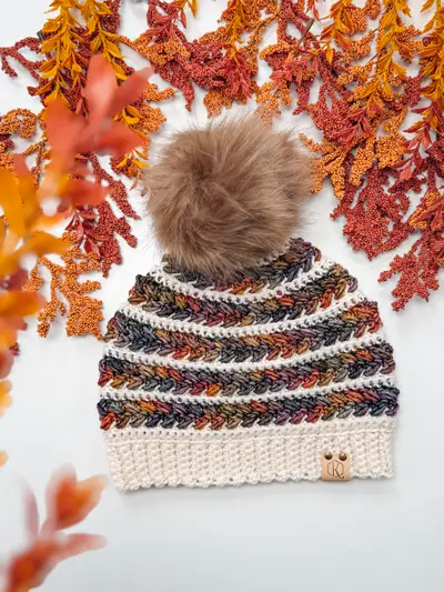 Multicolor striped Wheat Stitch Crochet Beanie with a cream brim and a brown pom pom