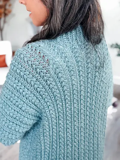 Back view of the blue Wheat Stitch Crochet Cardigan showing the wheat stitch texture