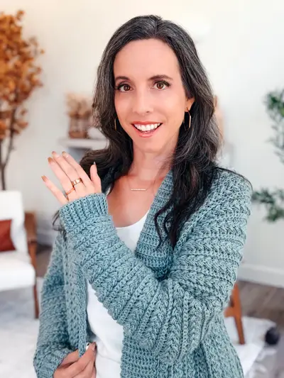 Smiling woman in the blue Wheat Stitch Crochet Cardigan