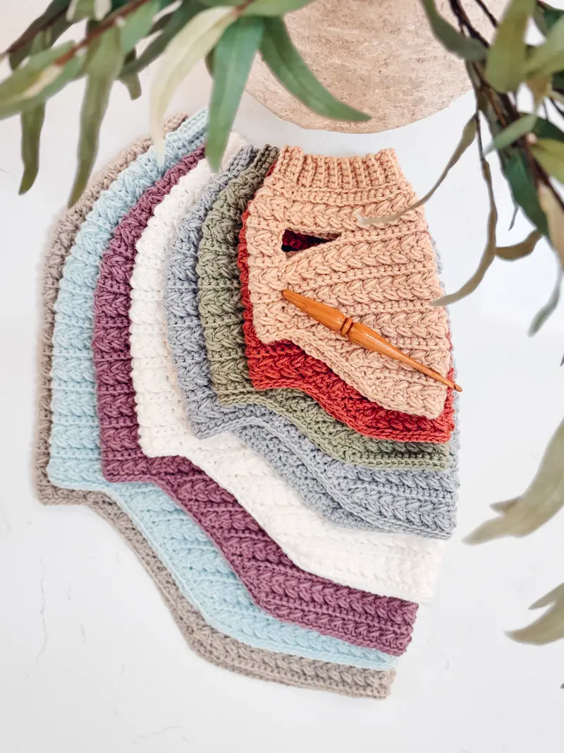 Wheat Stitch Crochet Dog Sweaters fanned out in a rainbow of colors