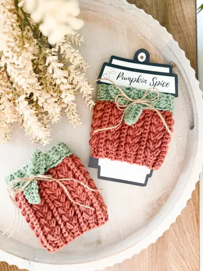 Rust Wheat Stitch Pumpkin Cozy with a sage leaf on a Pumpkin Spice card