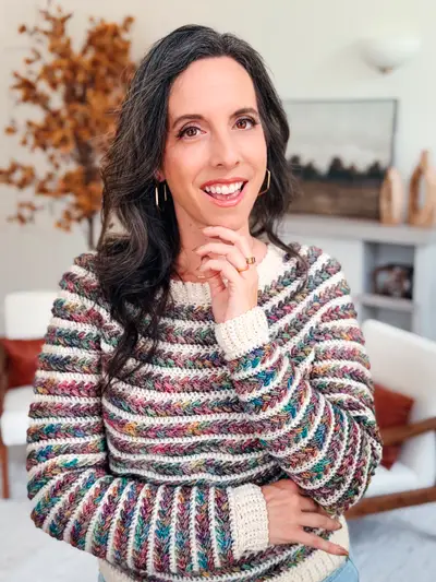 Smiling woman in the striped Wheat Stitch Crochet Sweater