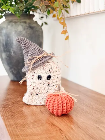 Wheat Stitch Ghost in speckled white with a gray hat on a wooden table