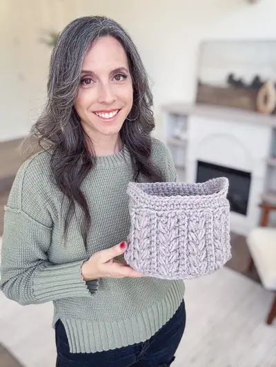 Woman holding a lavender Wheat Stitch Nesting Basket