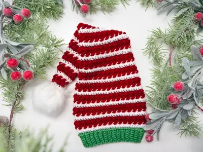 Red and white striped Wheat Stitch Elf Hat with a green brim