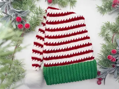 Red and white striped Wheat Stitch Elf Hat with greenery