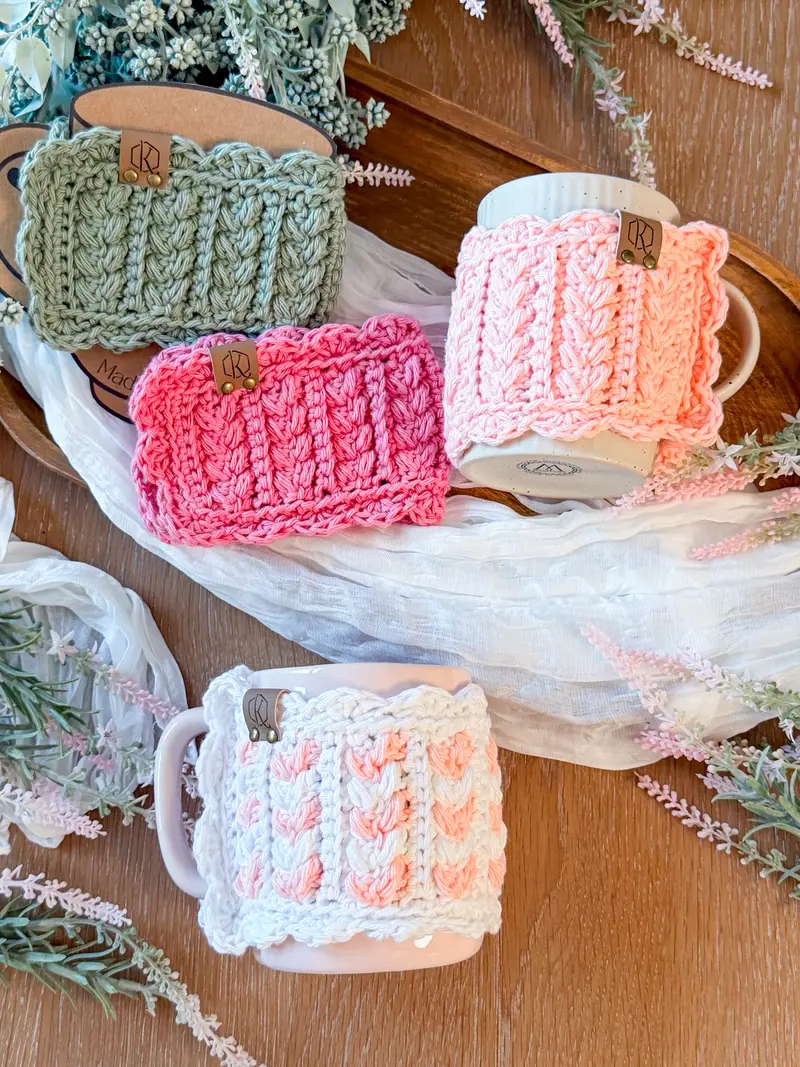 Wheat Stitch Scalloped Mug Cozies in sage, pink and white on mugs