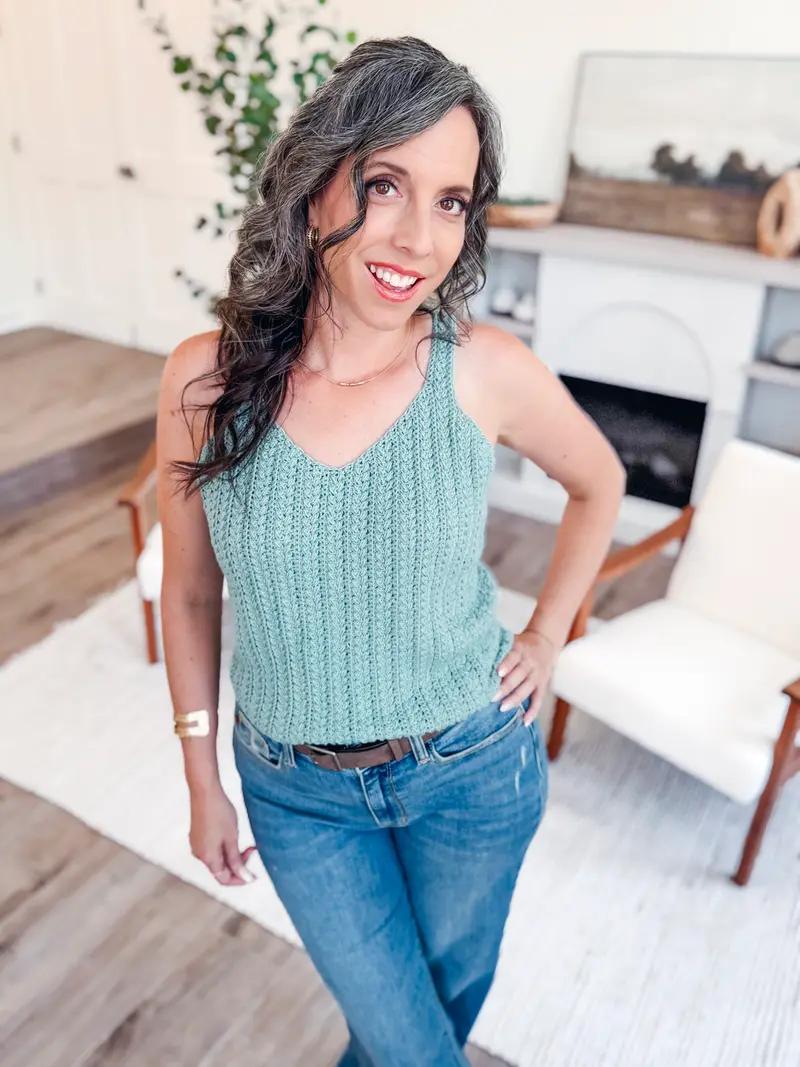 Woman wearing the sage Wheat Stitch Tank Top with jeans