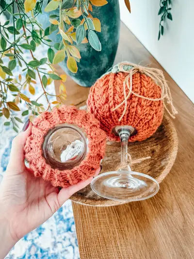 Orange pumpkin style Wheat Stitch Wine Glass Cozies with twine bows
