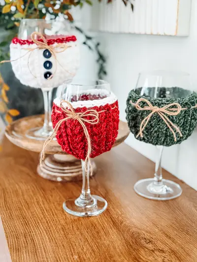 Snowman, red and green Wheat Stitch Wine Glass Cozies on wine glasses