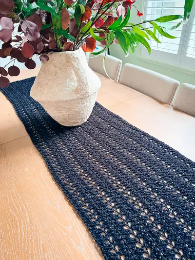 Black Willow Mesh Crochet Wrap used as a table runner
