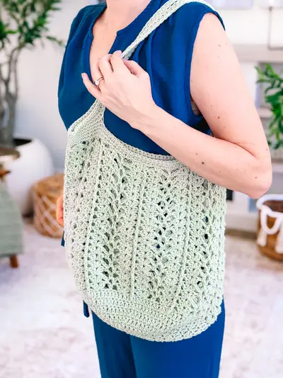 Sage Willow Mesh Market Bag carried over the shoulder