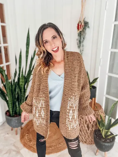 Laughing woman wearing the tan Wish Upon A Star Mosaic Cardigan