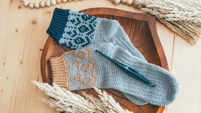 Woodland Walker Crochet Socks in blue with teal and tan colorwork cuffs
